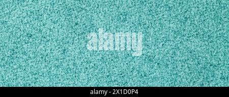 Light blue fluffy background of soft, velour fabric. Texture of turquoise wool textile backdrop, closeup. Stock Photo