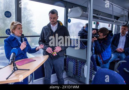 16 April 2024, Mecklenburg-Western Pomerania, Wakenstädt: Manuela Schwesig (SPD), Minister President of Mecklenburg-Vorpommern, speaks alongside Tino Schomann (CDU), District Administrator of Nordwestmecklenburg, at the official launch of the on-call bus network on a public bus. Due to heavy rain, the official opening of the on-call bus network was moved to a bus. The on-call bus system in Mecklenburg-Vorpommern is to be expanded nationwide over the next few years, with Schwesig (SPD) and Economics Minister Meyer (SPD) giving the official go-ahead. The district of Nordwestmecklenburg has been Stock Photo