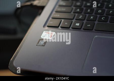 AMD A12 sticker on a gray laptop Stock Photo