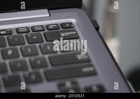 The on and off button on a laptop is integrated with the keyboard which is on Stock Photo