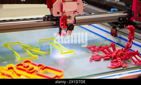 Three dimensional 3d printer printing letter M. Stock Photo