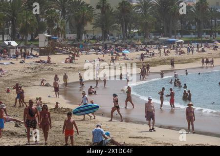 Los Cristianos, Tenerife, April 16th 2024 - Tourists Tourists enjoy the sun, sand and sea at Los Cristianos in Tenerife, despite anti-tourist anger amongst some locals. Credit: Stop Press Media/Alamy Live News Stock Photo