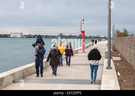 Detroit, Michigan - People walking on the Detroit Riverwalk, on the site of the old Uniroyal tire plant. Stock Photo