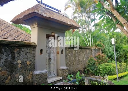 a Traditional balinese handmade carved wooden door. Bali style furniture with ornament details Stock Photo