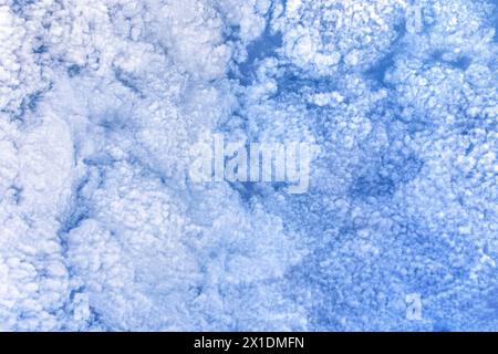 Altocumulus fluffy white clouds - atmospheric weather. Stock Photo