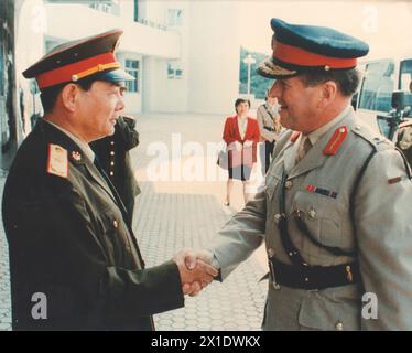 Major General Bryan Dutton (right), Commander British Forces Hong Kong, shakes hands with Major General Zhou Borong, Commander of the first Advance Party of the People's Liberation Army to arrive in Hong Kong, at Headquarters British Forces, Prince of Wales Barracks, Hong Kong 21 April 1997. Stock Photo