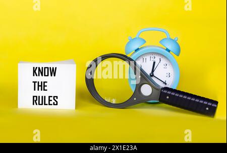 Know the rules word on a notepad on a yellow background. concept of business process regulation. Stock Photo