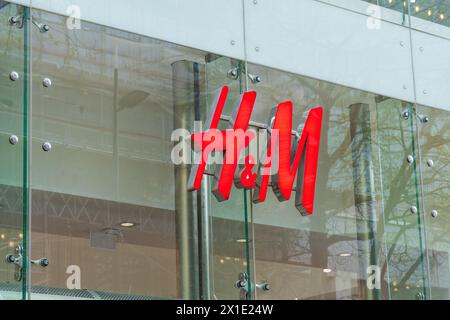 Birmingham, UK 16th April 2024:  External signage of the women's clothing store, H and M Stock Photo