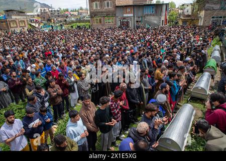 Relatives and residents offer prayers during a funeral for victims who died after a boat capsized in the Jhelum River. At least six people died and 19 are missing after the boat capsized in the Jhelum River near Srinagar, with most of the passengers being children on their way to school. Rescuers and the Indian Army's marine commandos are scrambling to find survivors as hundreds worried and mourning. Heavy rains fell over the Himalayan region in the past few days, led to higher water levels in the river which caused the tragedy. Stock Photo