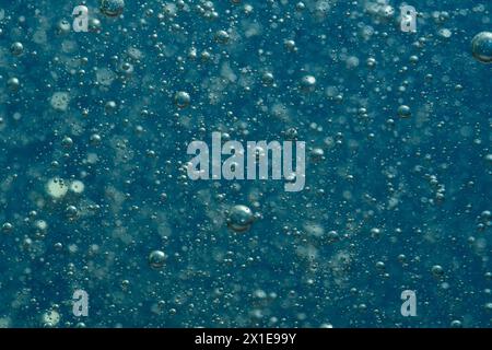 Blue water with bubbles closeup. Abstract background and texture for design Stock Photo