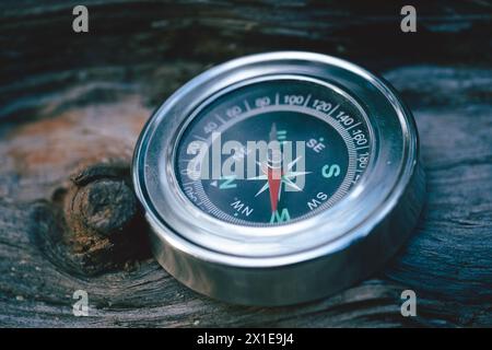 Compass on old wood background. Vintage style and selective focus Stock Photo