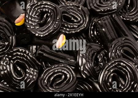 Jelly anise candy. Black jelly candies. Top view. Delicious gelatin candies. Stock Photo