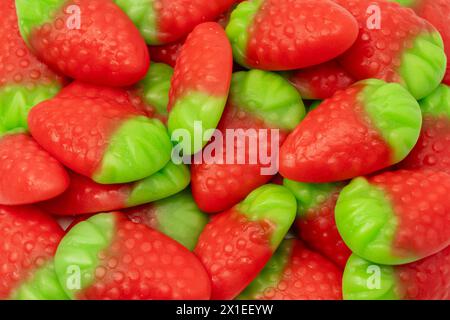 Jelly strawberry candies isolated on a white background. Top view. Delicious gelatin candies. Stock Photo
