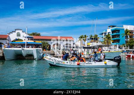 Tourists taking boat tours. Huatulco, Oaxaca, Mexico. Stock Photo