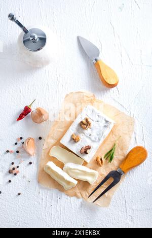 camambert cheese with nuts on craft paper Stock Photo