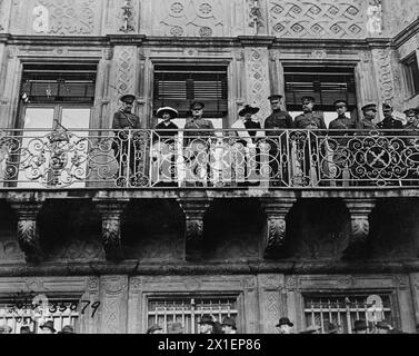 General John J. Pershing and the Grand Duchess of Luxembourg with several other American generals reviewing the 16th infantry, 1st Division, as they pass the Grand Palace in Luxembourg ca. November 1918 Stock Photo