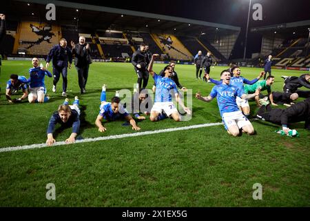 Stockport County players celebrate winning the League Two title following the Sky Bet League Two match at Meadow Lane, Nottingham. Picture date: Tuesday April 16, 2024. Stock Photo