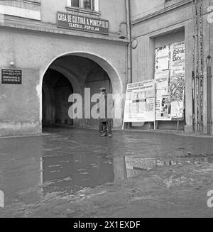 Medias, Sibiu County, Socialist Republic of Romania, approx. 1975. Slushy pavement in front of a local theater in the historical center. Stock Photo