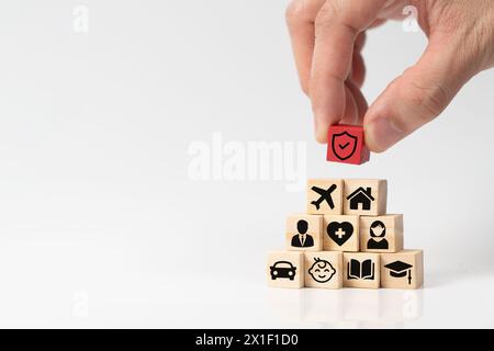 Insurance service concept with shield protection icon on top of various types of insurance icons Stock Photo