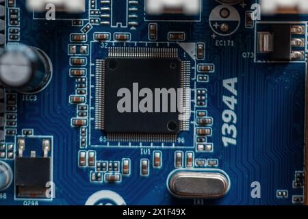 Chip On A Blue Motherboard. Computer Hardware And Processor Stock Photo