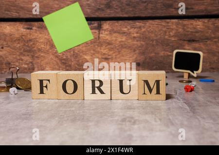 Forum Word In Wooden Cube. Stock Photo