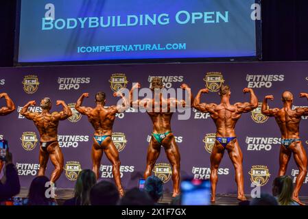 Male bodybuilding competitors are seen in action on stage of the 2024 ...