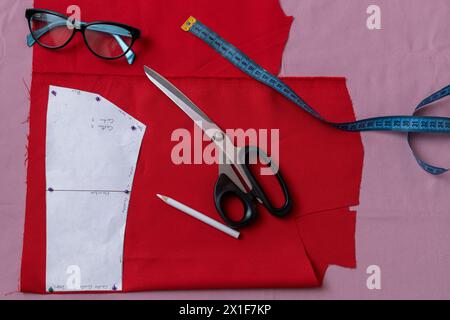 Sewing pattern with scissors and tape measure. Stock Photo
