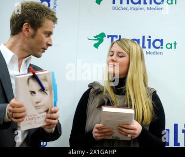 Austrian Natascha Kampusch presents her autobiography entitled '3096 days' in the bookstore 'Thalia' in Vienna on 9 September 2010. In the picture: Natascha Kampusch and TV presenter and journalist Christoph Feuerstein. Kampusch was kidnapped at the age of 10 and held in a cellar for over eight years. - 20100909 PD1455 - Rechteinfo: Rights Managed (RM) Stock Photo