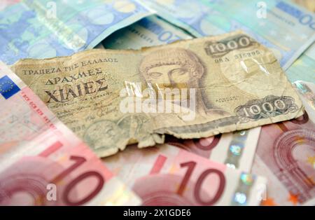 Illustration on currency, debit and euros, captured on 26 September 2011.   In the picture:  Old greek 1.000 Drachma note and Euro notes. - 20110926 PD4600 - Rechteinfo: Rights Managed (RM) Stock Photo