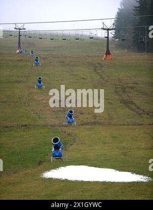 No snow in sight in Salzburg, Austria on 27 November 2014. In the picture: Snow cannons stand on the green meadow in the skiing region Flachau. - 20141127 PD1517 - Rechteinfo: Rights Managed (RM) Stock Photo