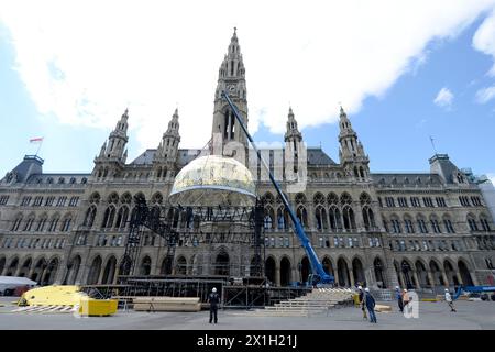 Vienna - Stage building for Life Ball 2015 on Vienna's city hall square on 7th May 2015. The Life Ball in Vienna is the biggest charity event in Europe supporting people with HIV or AIDS. 23rd Life Ball will held on 16th May 2015. PICTURE: the golden dome - 20150507 PD2397 - Rechteinfo: Rights Managed (RM) Stock Photo