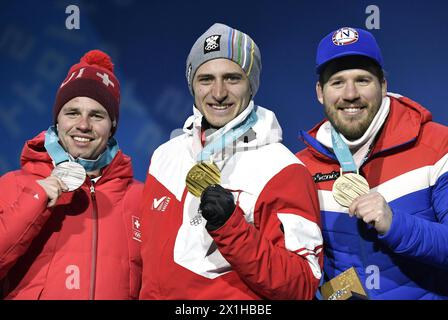 Gold medalist Matthias Mayer of Austria (C), Silver medalist Beat Feuz of Switzerland (L) and bronze medalist Kjetil Jansrud of Norway pose for photos during medal ceremony of men's super giant slalom of Alpine Skiing at the 2018 PyeongChang Winter Olympic Games at Medal Plaza, PyeongChang, South Korea, on Feb. 16, 2018. - 20180216 PD6808 - Rechteinfo: Rights Managed (RM) Stock Photo