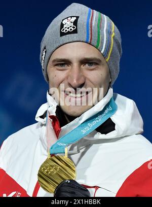 Gold medalist Matthias Mayer of Austria poses for photos during medal ceremony of men's super giant slalom of Alpine Skiing at the 2018 PyeongChang Winter Olympic Games at Medal Plaza, PyeongChang, South Korea, on Feb. 16, 2018. - 20180216 PD7068 - Rechteinfo: Rights Managed (RM) Stock Photo