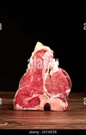 Meat Prime Cuts On A Wooden Table Against A Dark Black Background Stock 