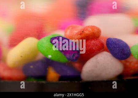 This images is about Colorful stones on a black background. Shallow depth of field. Stock Photo
