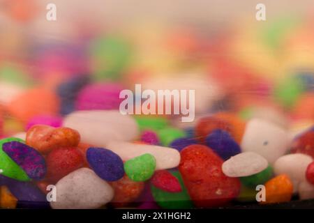 A vibrant gemstone rests in a crystal bowl, bathed in soft light with a shallow depth of field for a captivating focus. Stock Photo