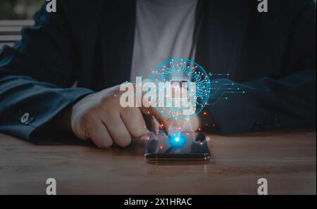 Businessman using smartphone for digital chatbot technology AI, robot application,conversation assistant,automatical respond to online to help custome Stock Photo