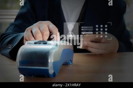 Businessman using EDC (Electronic Data Capture) and login for payment online shopping product, Involved in mobile shopping at home, purchasing goods o Stock Photo