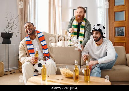 Three stylish men, different ethnicities, sit happily on a sofa, building a heartwarming friendship. Stock Photo