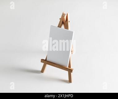 Stack of blank business cards on small wooden easel. Stock Photo