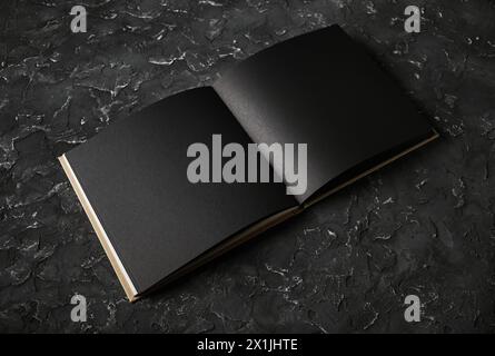 Blank black booklet on black plaster background. Responsive design template. Stock Photo