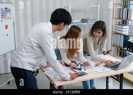 team of UI UX web designer are working together to develop mobile responsive websites with UI UX front end designer previews Stock Photo