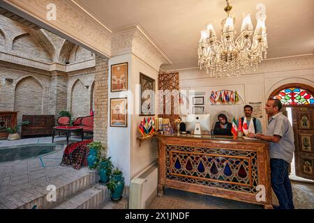 Interior view of lobby and reception desk of an upscale boutique hotel situated in a traditional Iranian house. Isfahan, Iran. Stock Photo