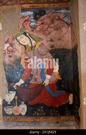 Close up view of a colorful fresco inside the Chehel Sotoun Palace depicting a 17th century Persian woman. Isfahan, Iran. Stock Photo