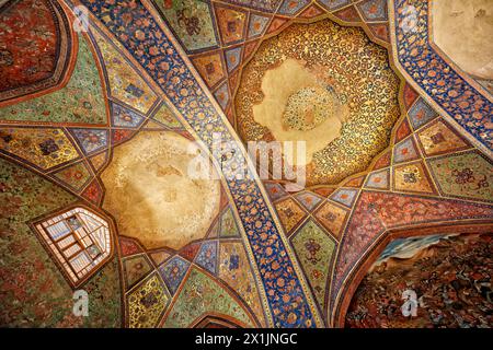 View from below of the ornate vaulted ceiling in the 17th century Chehel Sotoun Palace in Isfahan, Iran. Stock Photo