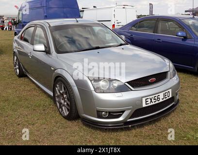 Three-quarters front view of a 2006, Silver, Ford Mondeo, on display at the 2023 British Motor Show Stock Photo