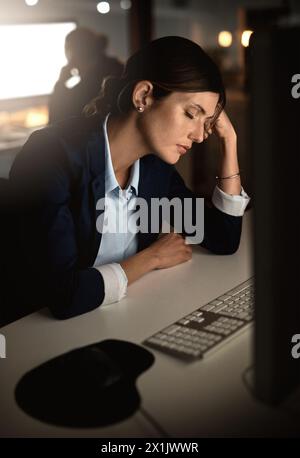 Sleeping, burnout or tired businesswoman by computer overwhelmed by deadlines with fatigue at desk. Lazy worker, night or exhausted consultant resting Stock Photo