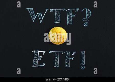 Bitcoin and ETF inscription in chalk close-up on a black background. Cryptocurrency, virtual reality, coin of the future. Stock Photo