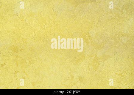 Texture of golden decorative plaster or concrete. Abstract gold grunge background for design. Stock Photo