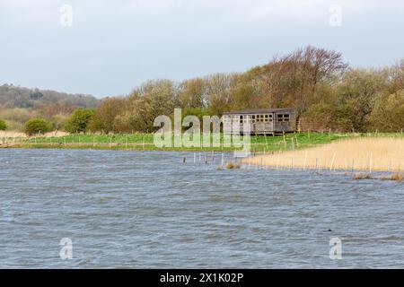 The Allen Hide at Leighton Moss viewed from the Eric Morecambe Hide Stock Photo